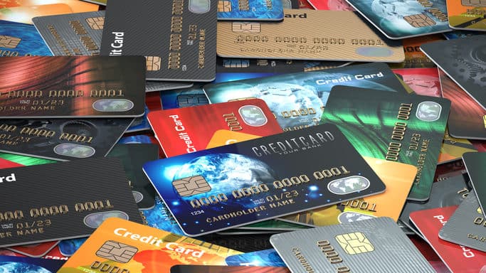 Pile of colored credit cards background,