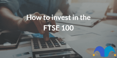 Business man using calculator with computer laptop with the text “How to invest in the FTSE 100” and The Motley Fool jester cap logo