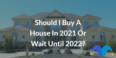 Large home with the text “Should I buy a house in 2021 or wait until 2022?” and The Motley Fool jester cap logo