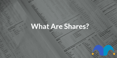 Person in front of the computer with the text "What are shares" and the Motley Fool Logo
