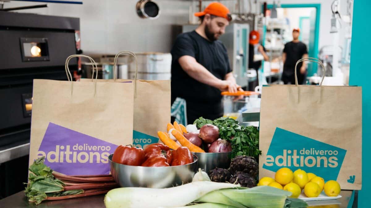 Chef preparing food to be delivered by Deliveroo Editions