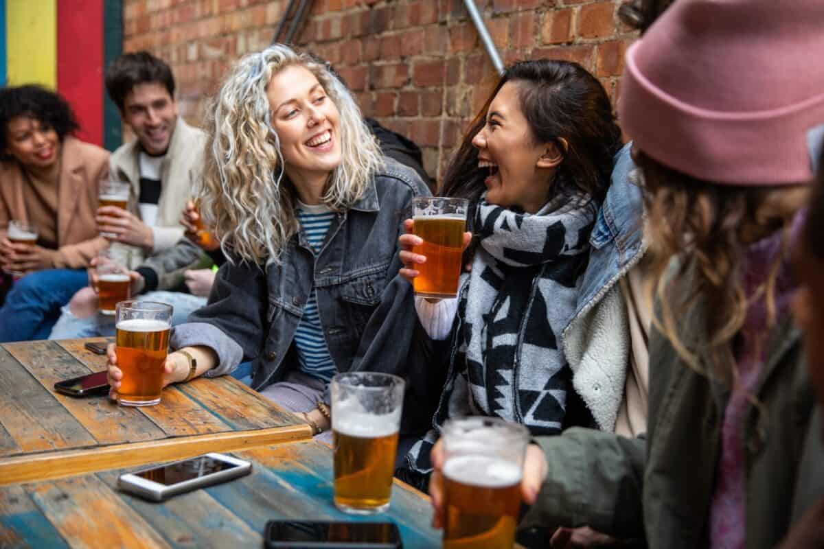 Group of friends meet up in a pub